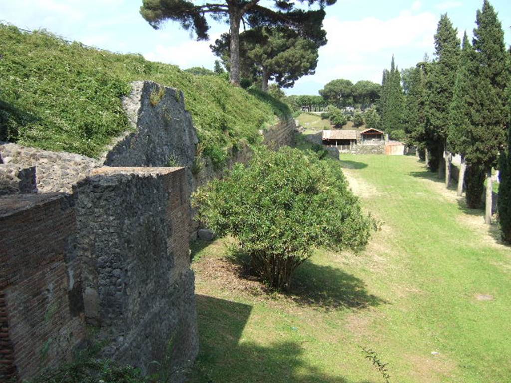 Tower II Pompeii. December 2005. Looking east from tower along southern city walls towards Porta Nocera.